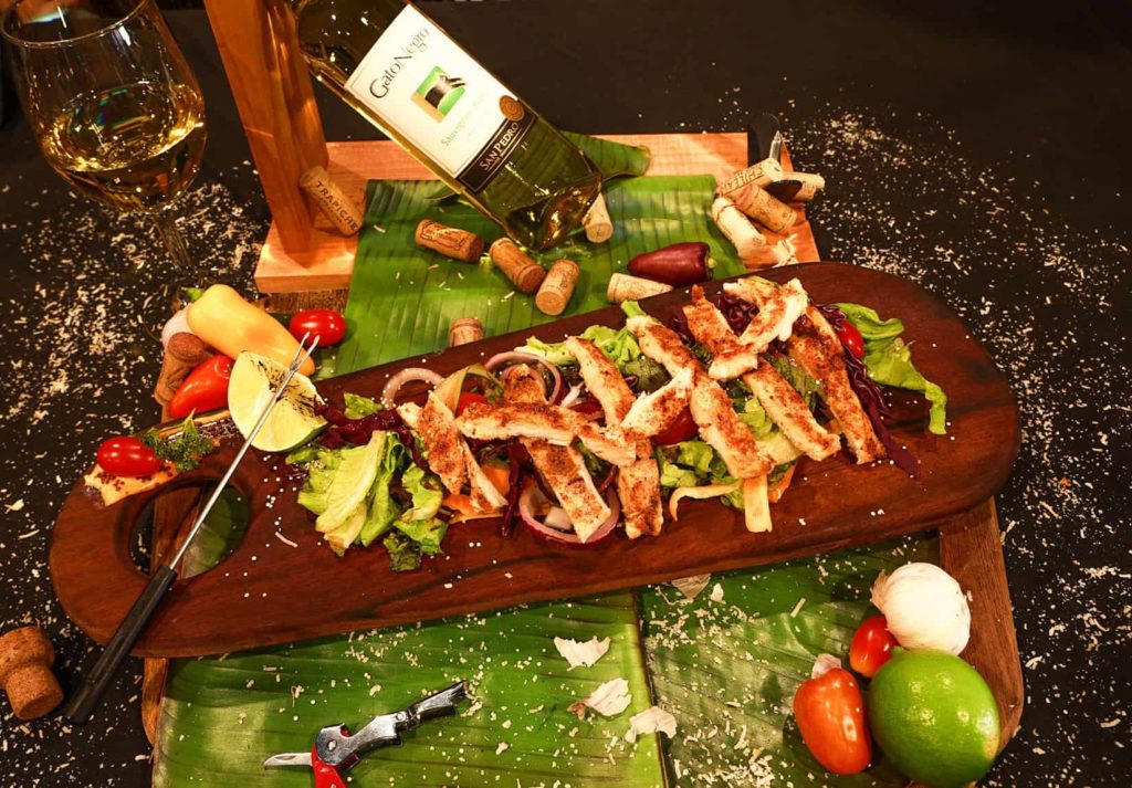 san ignacio belize restauran thr wine house chicken strips salad paired with wine