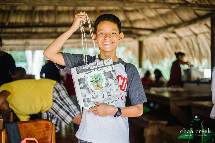 eco kids summer camp 2019 day 7 boy posing with arts crafted handbag