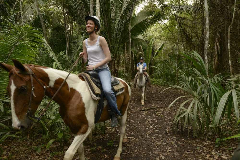 belize horseback riding couple in jungle social distancing