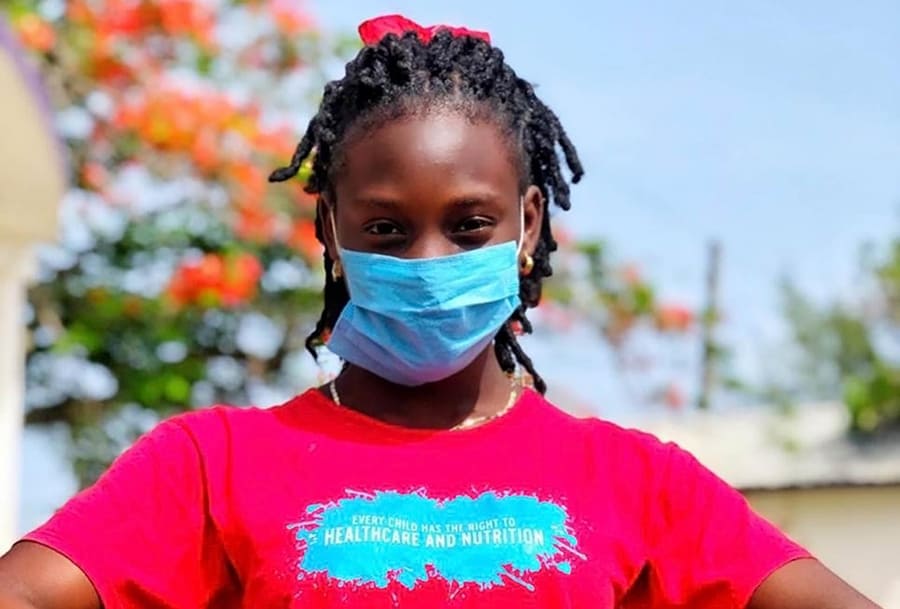 young girl in Belize wearing mask coronavirus covid19