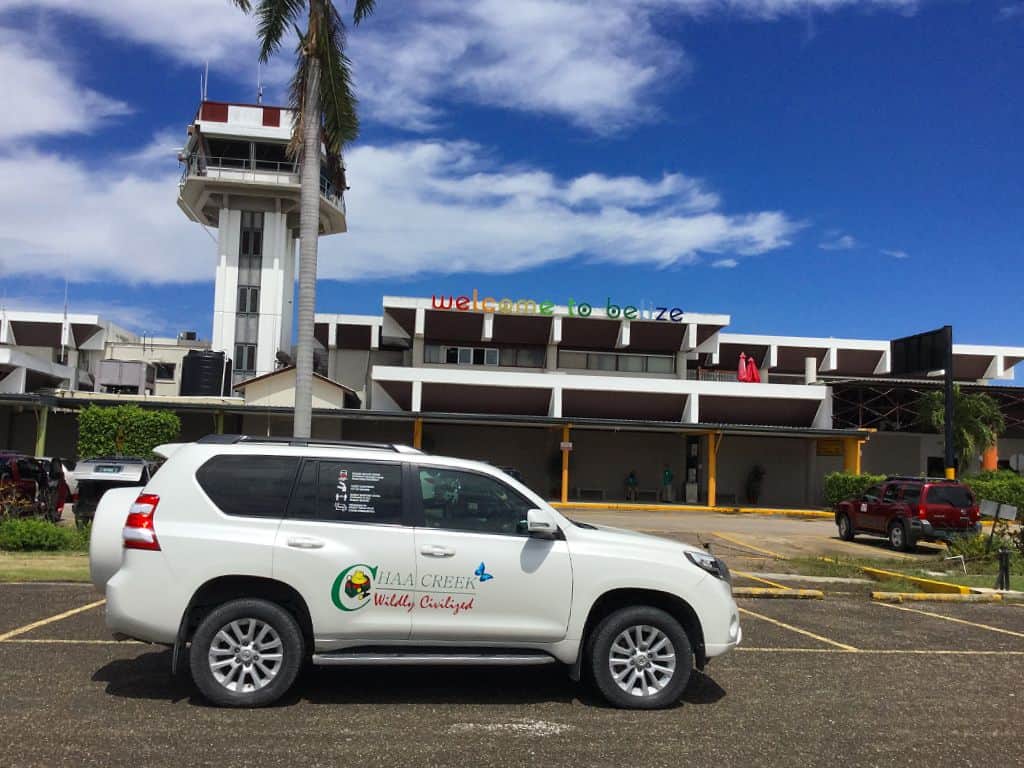 chaa creek toyota prado suv parked at the belize international airport parking lot
