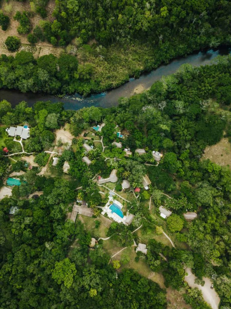 aerial photo of the chaa creek private nature reserve property including the river