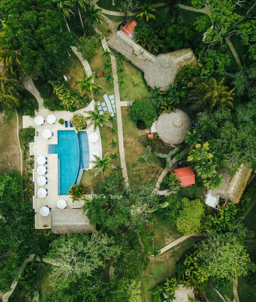 aerial photo of the swmming pool area of the lodge at chaa creek