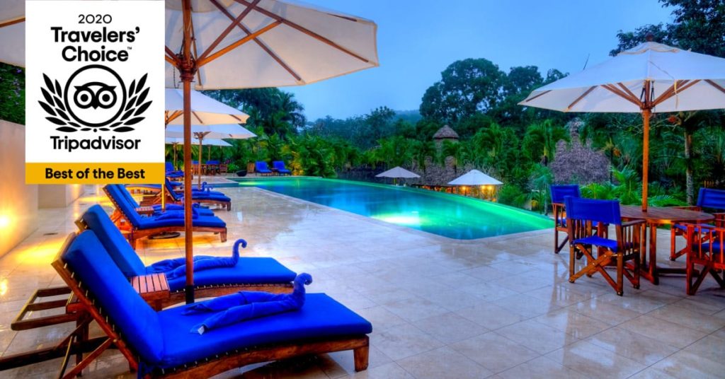 belize chaa creek resort best of best travelers choice 2020 swimming pool at dusk