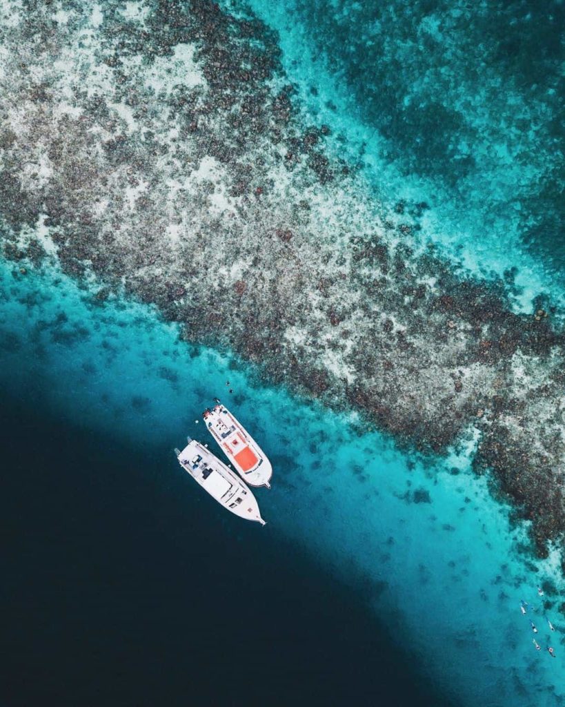 Belize blue hole aerial photo with 2 boats
