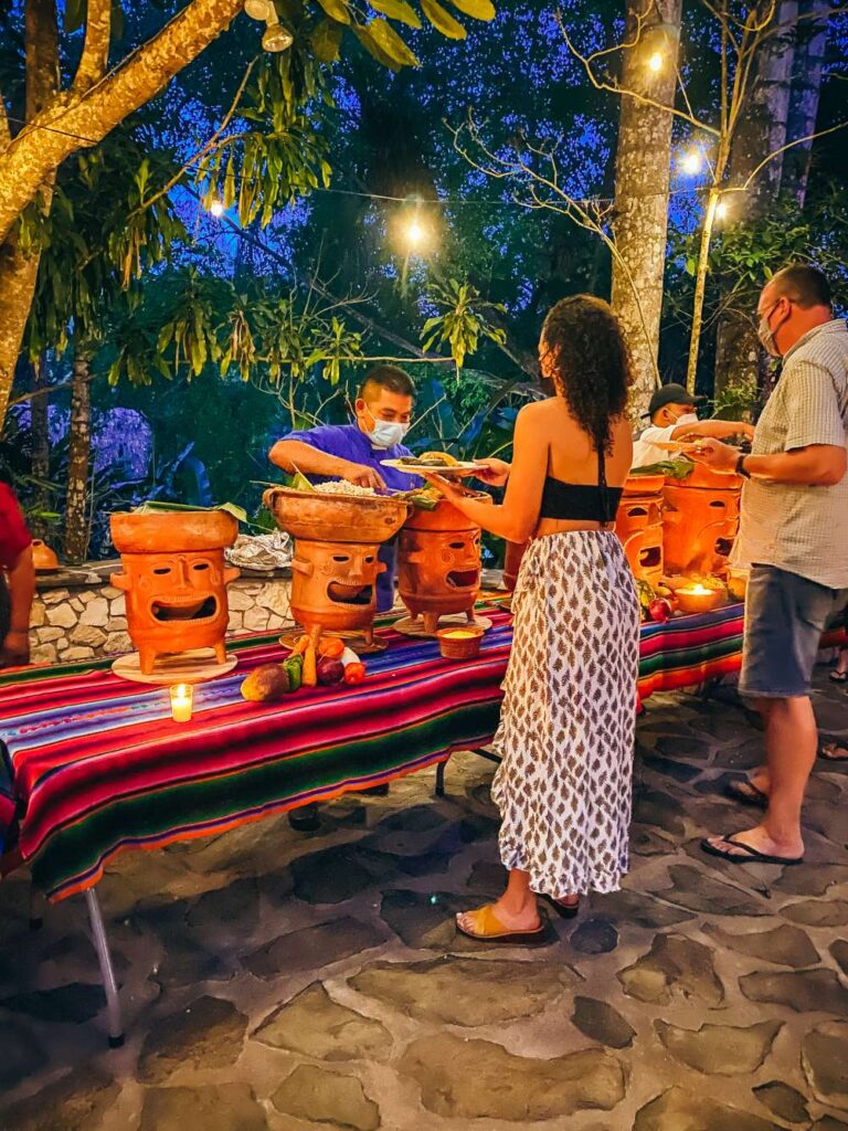 chaa creek resort guests being served at a maya buffet