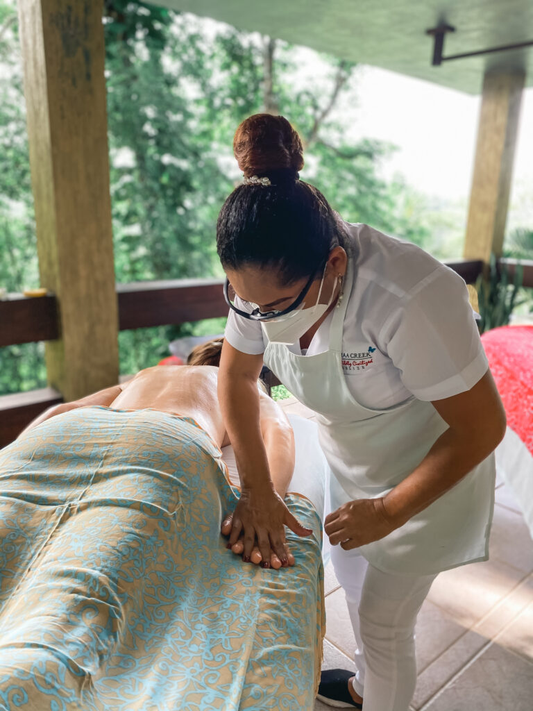 woman enjoying massage spa therapy at chaa creek