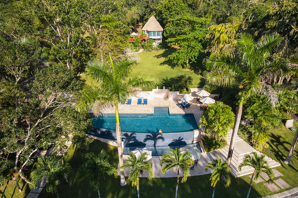 belize jungle lodge chaa creek aerial view of pool and jungle